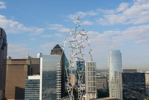 Humanlike sculptures are perched on Dallas rooftops. Here’s why — and where to look