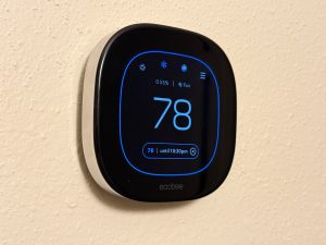 A thermostat set to 78 degrees
