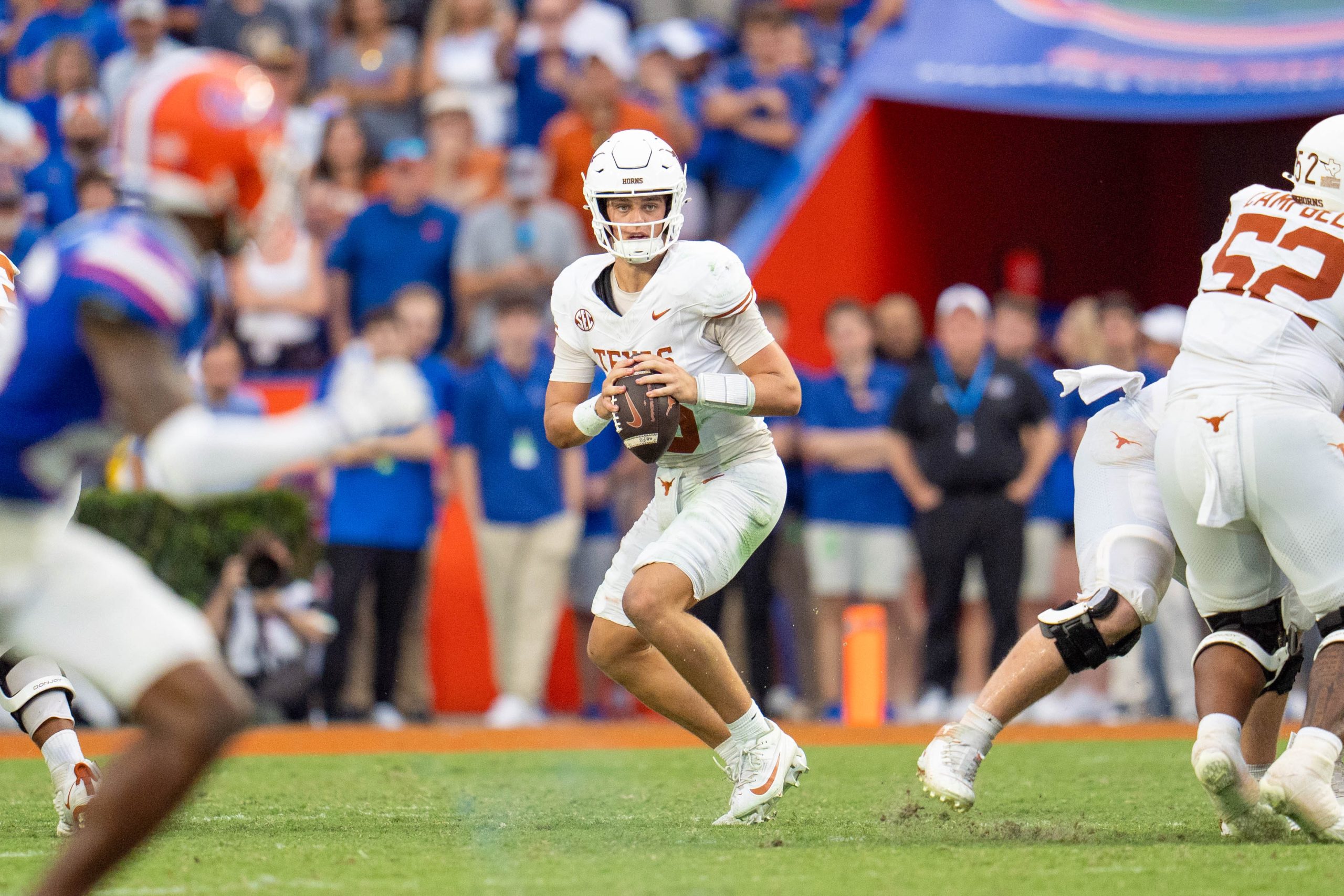 A quarterback weighs his options at the start of a play.
