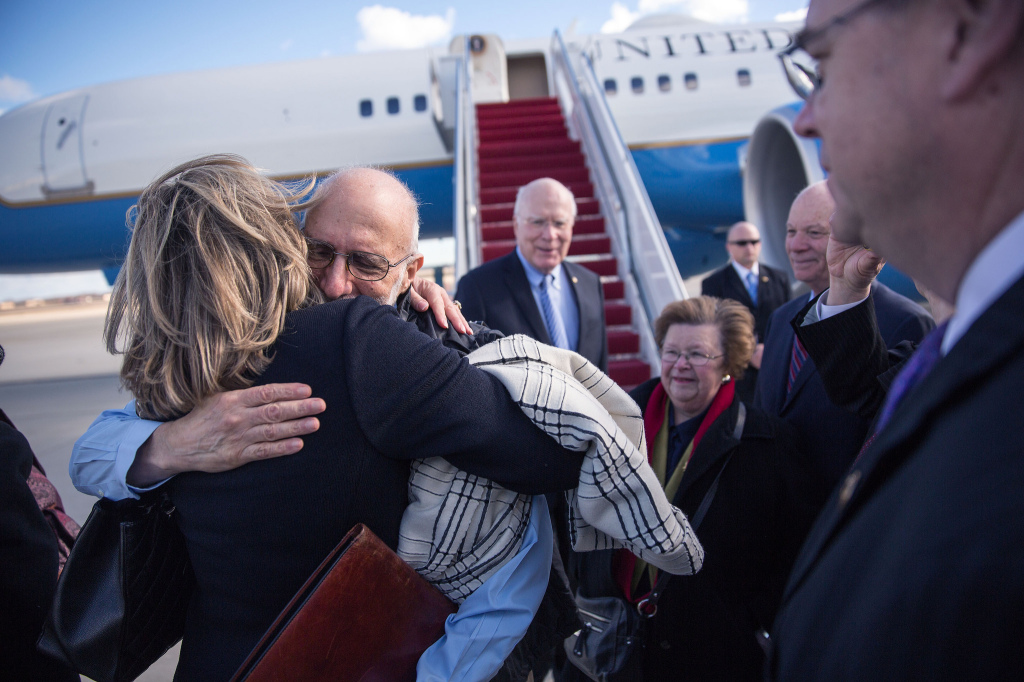 Gross is greeted with hugs after arriving at Joint Base Andrews in Maryland on Wednesday.