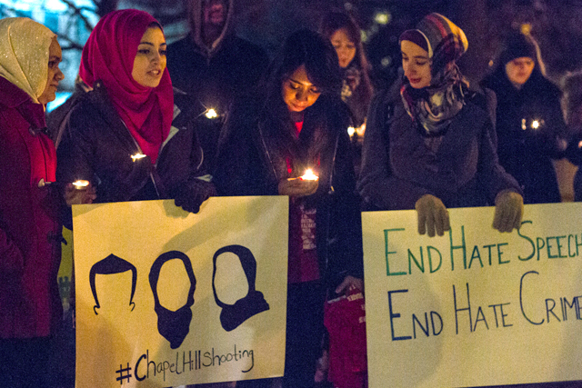 Students at the University of Missouri hold a vigil for the victims of the North Carolina shooting.