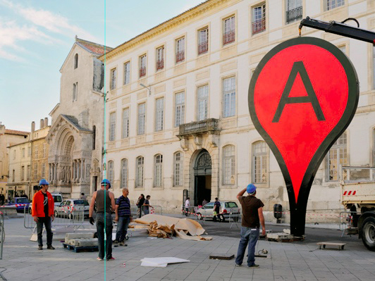 Aram Bartholl's project "Map" is a public space installation that incorporates Google Maps' big red pin.