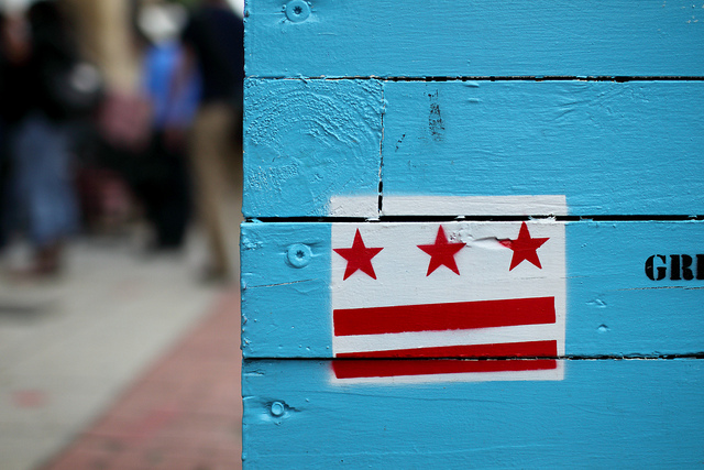 The Washington D.C. flag on a planter on H Street, NE.