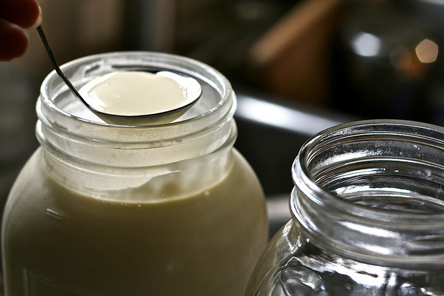 Skimming raw milk.