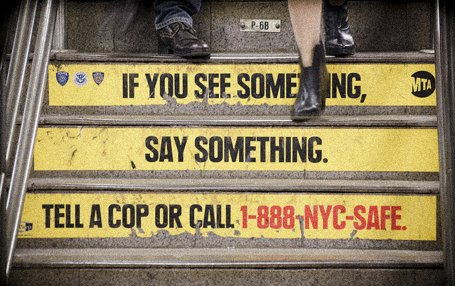 A public safety sign in a New York City MTA station.