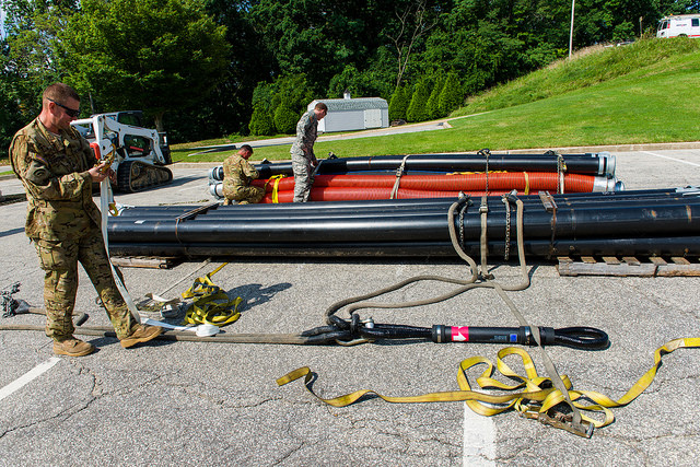 Maryland Army National Guard aviation conducts sling-load operations in the Ellicott City and Linwood areas to assist Howard County with its emergency repair of a ruptured sewer line.