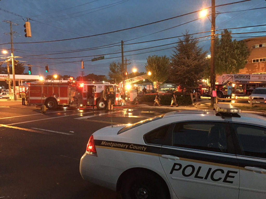 Montgomery County fire officials search the smoky  rubble of an apartment building after a blast injures 30 and displaces 100 in Silver Spring.