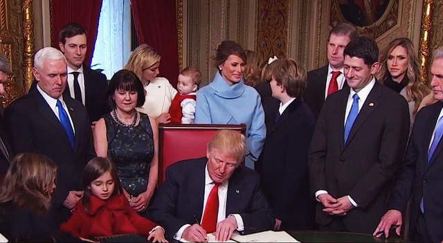 President Trump signs executive orders on Inauguration Day.