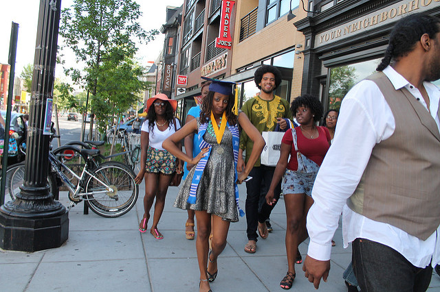 A Howard University Class of 2015 graduate struts down 14th Street in Northwest D.C.