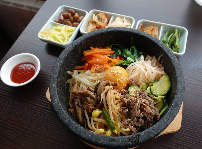 Dolsot Bibimbap, a Korean "mixed rice" dish served in a stone bowl.