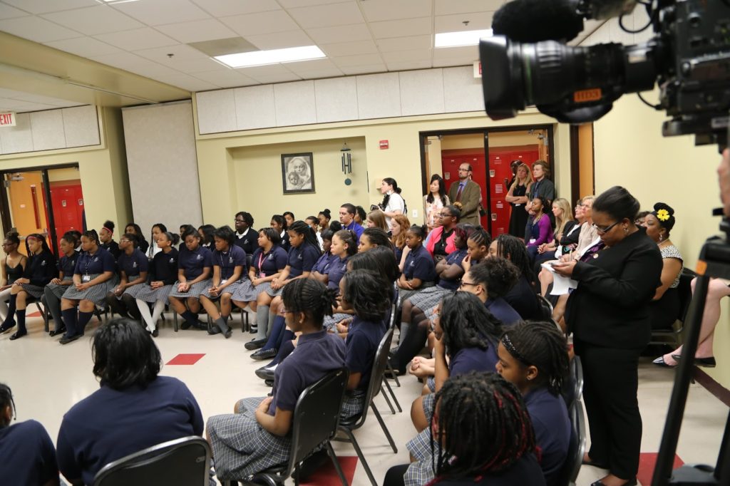 Charnice Milton, right, takes notes while reporting on assignment. 