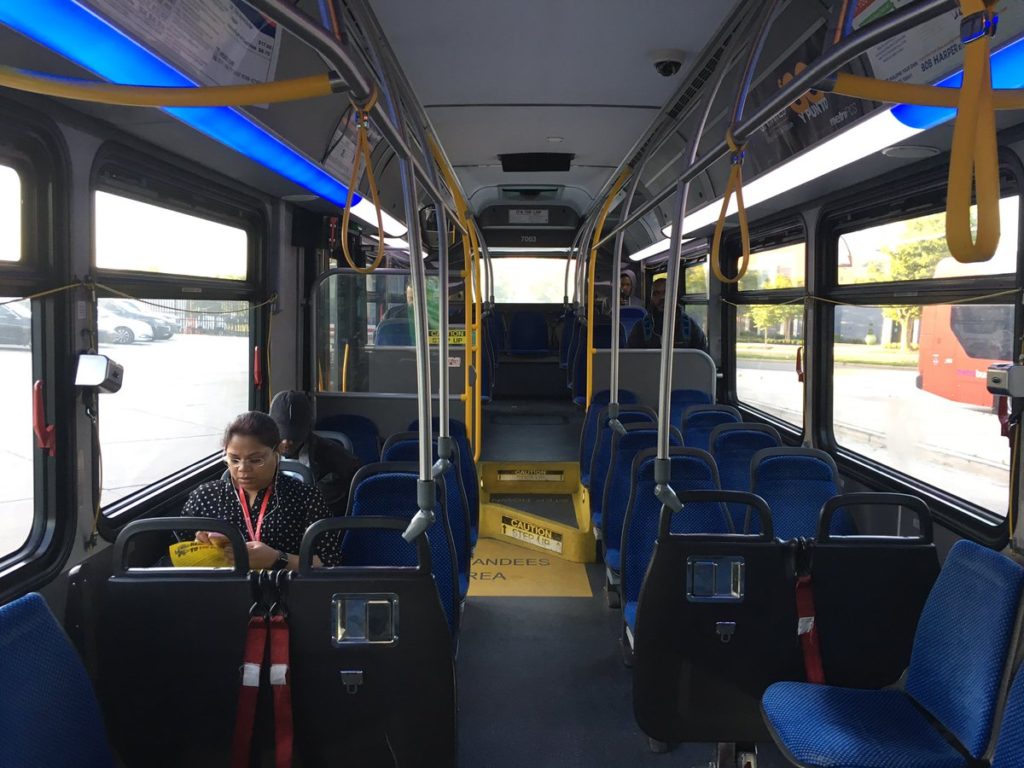 Commuters on a bus shuttle during a SafeTrack surge on the Orange Line.