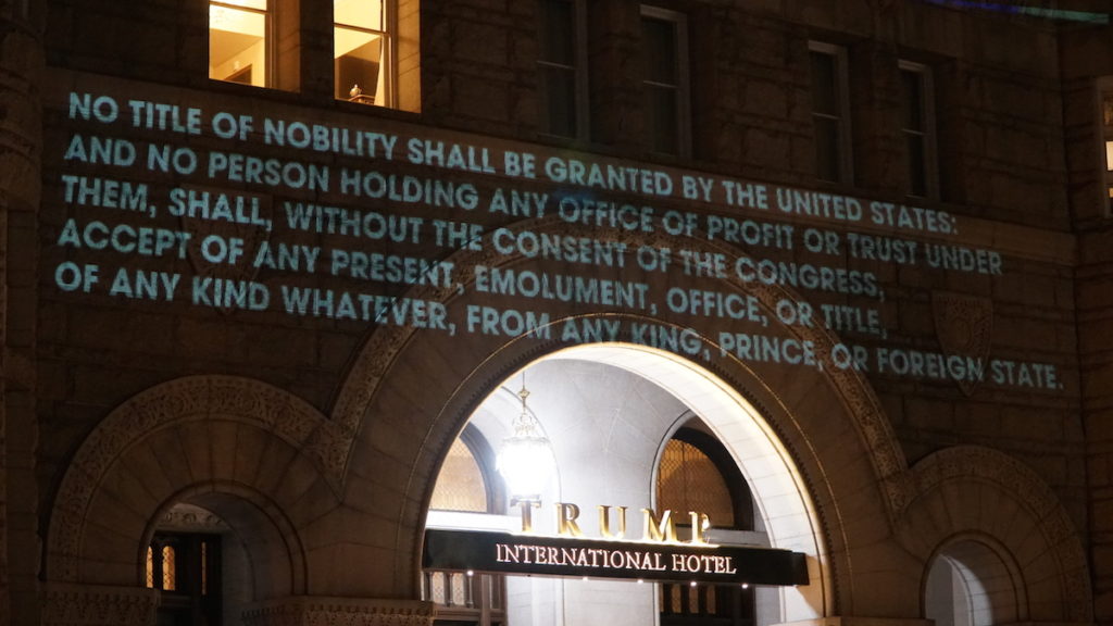 D.C. artist Robin Bell's protest outside Trump's D.C. hotel alleging a violation of the Emoluments Clause.