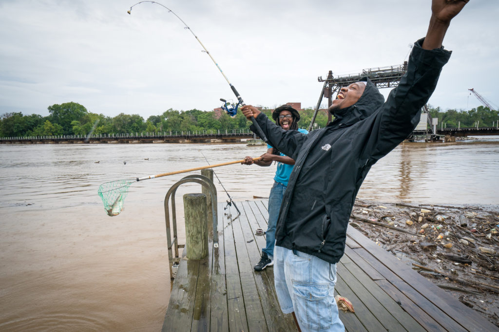 On the Anacostia River, William Mitchener catches his first fish with cousin Byron Coleman