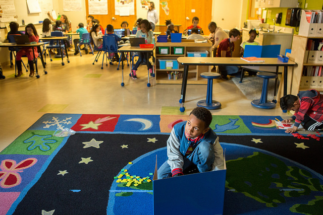 A third grade student works at a math station at Capital City Public Charter. 