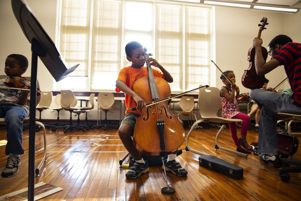 A D.C. Youth Orchestra student practices his cello. 