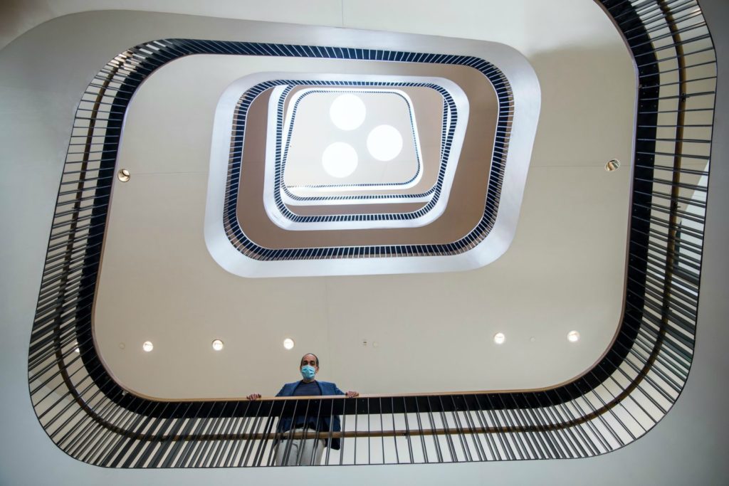 Richard Reyes-Gavilan, executive director of DC Public Library, poses on one of the newly renovated stairwells created by OTJ Architects and Mecanoo.