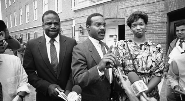 Wayne Curry, center, leaves the Prince George's County courthouse in Upper Marlboro, Maryland, Aug. 14, 1986 with clients James and Lonise Bias after the pair appeared before a grand jury investigating drug use and scholastic problems at the University of Maryland brought on by the death of their son basketball star Len Bias. 