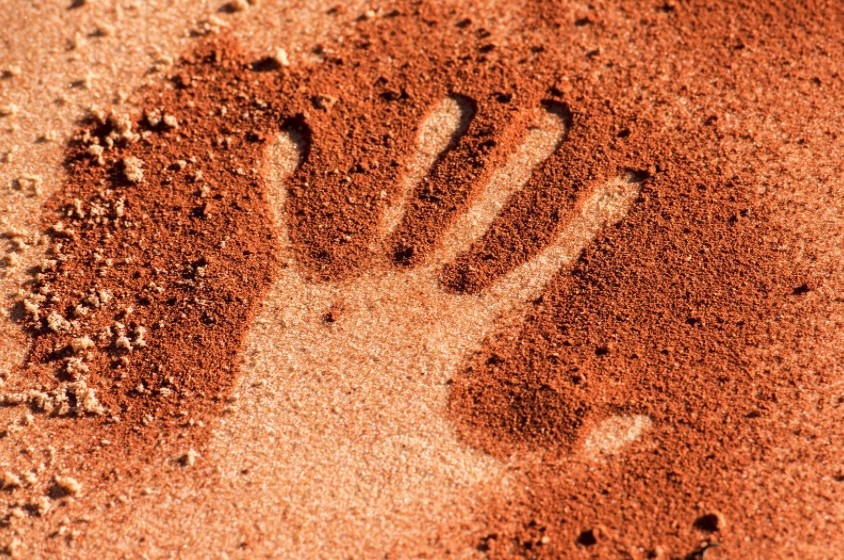 Hand print in red dirt
