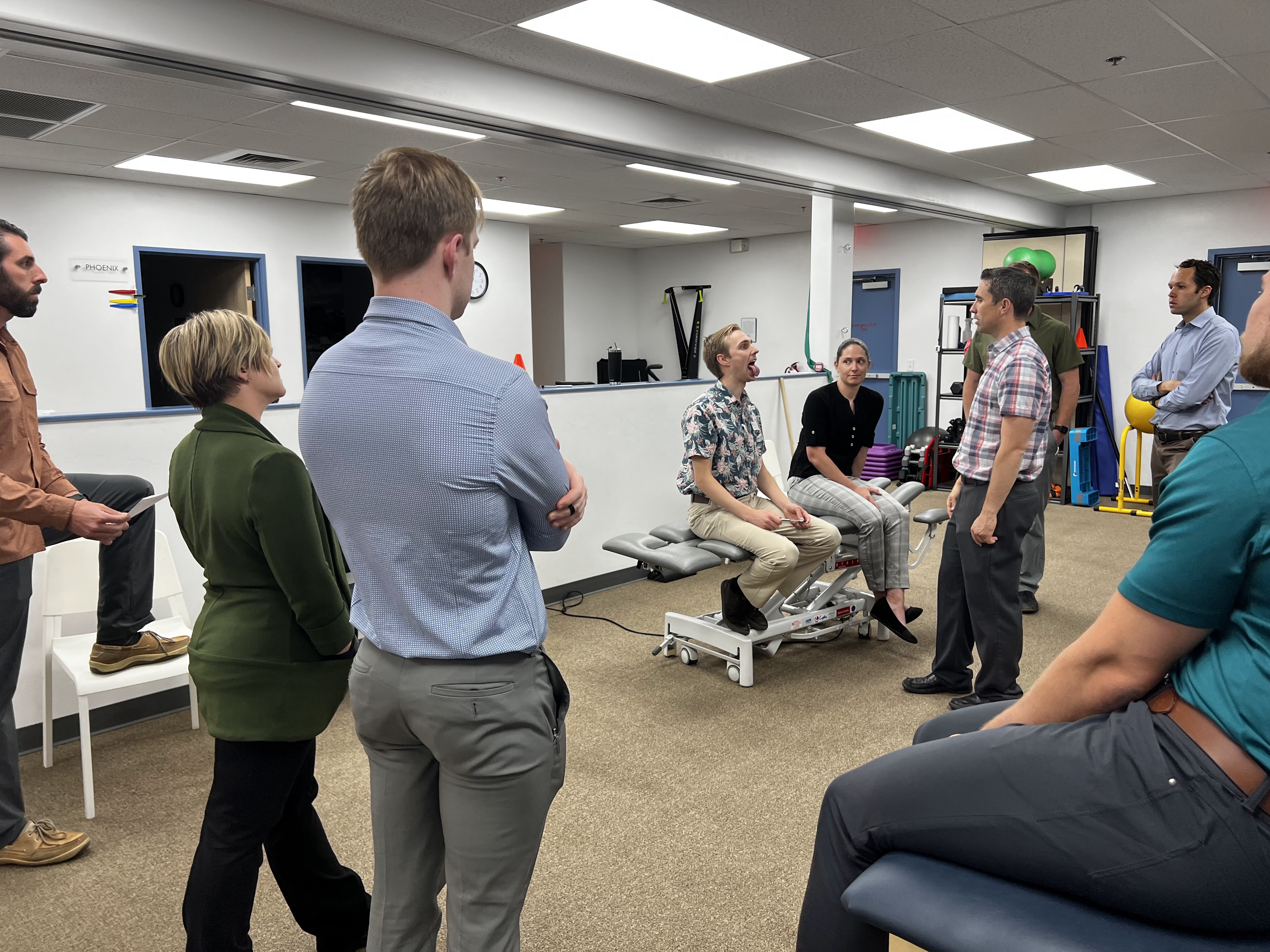 Physical therapists collaborating on TMD patient case studies