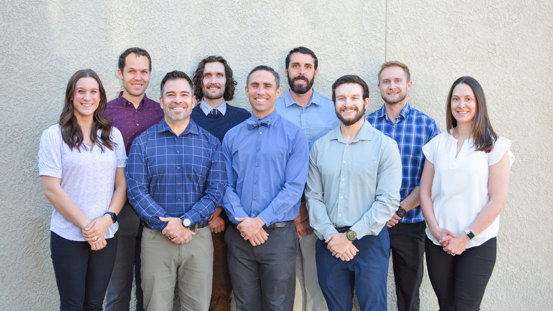 Team of physical therapists smiling for a group photo