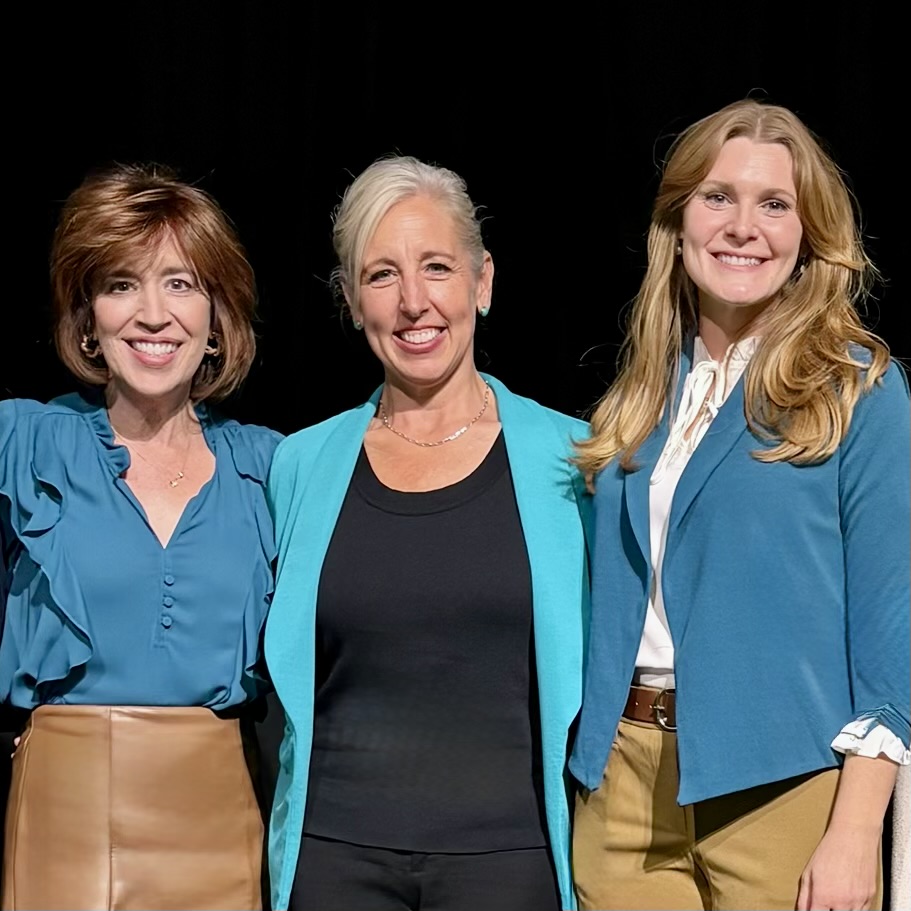 Heather Marra, PT, and Dr. Jennifer Degler photo holding sign