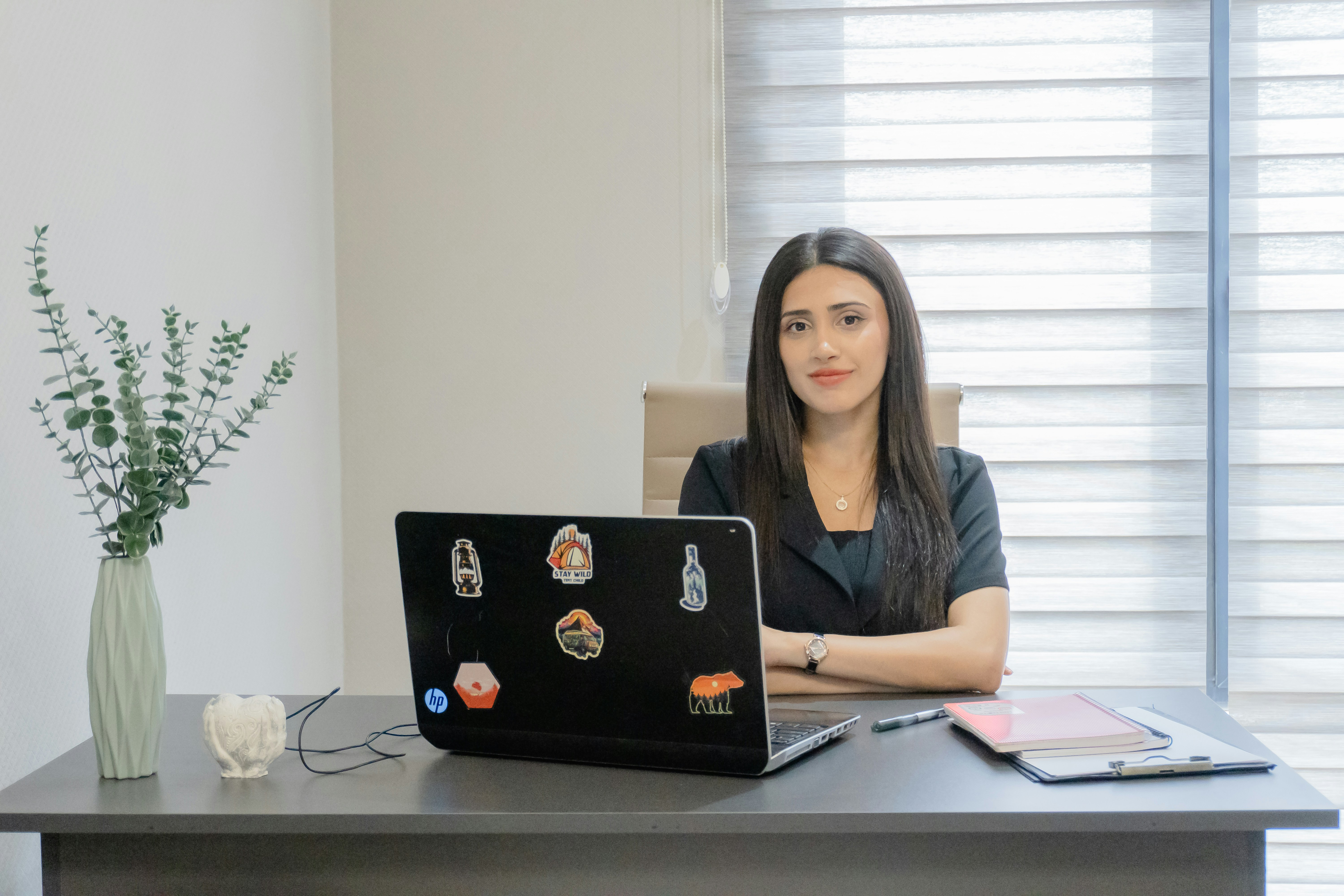 Young professional working on a laptop, illustrating focus and preparation for long-term career success.