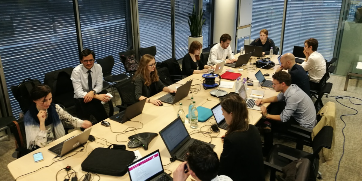 A team of fact checkers engaged in live-fact checking an election debate.