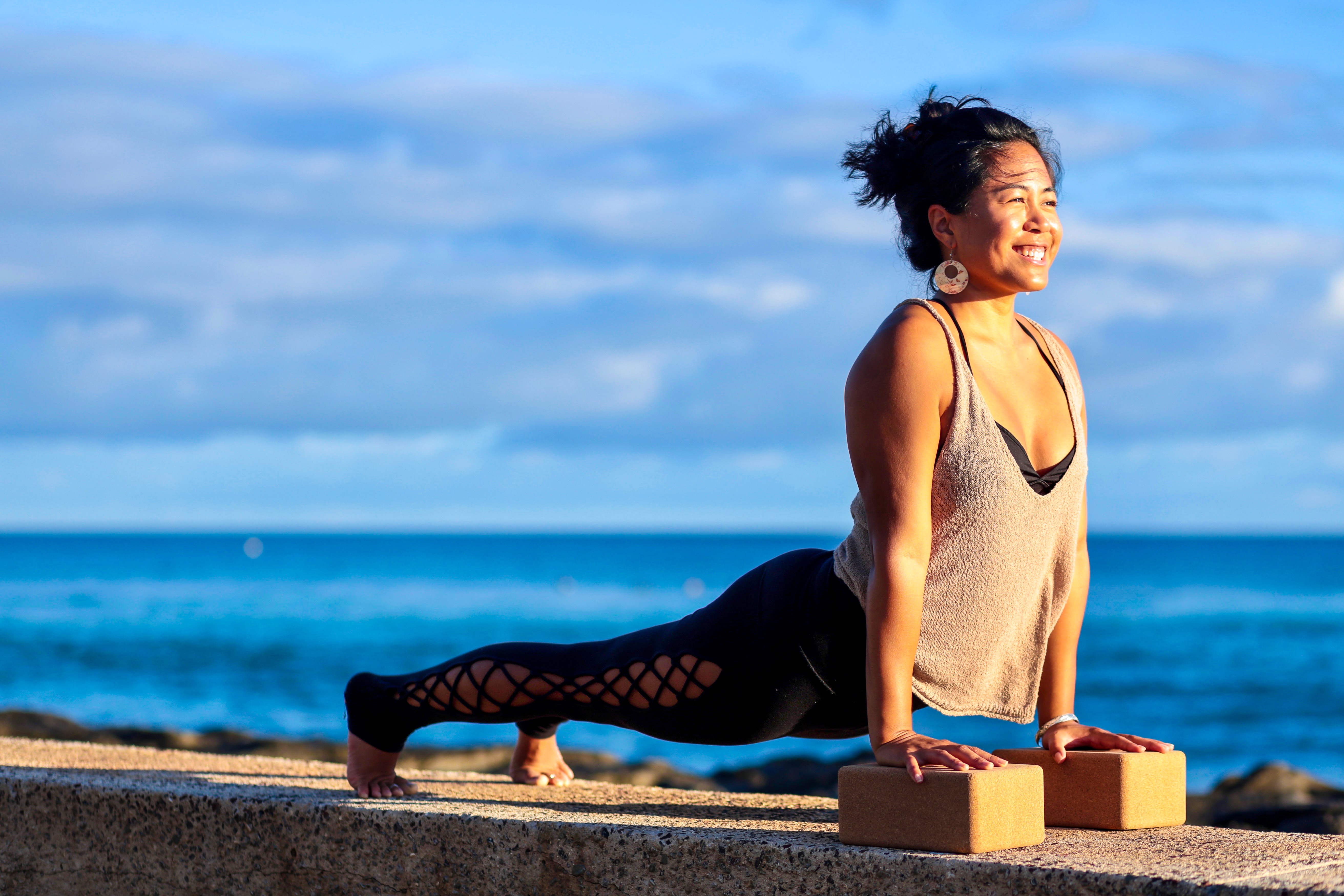 upward facing dog on beach
