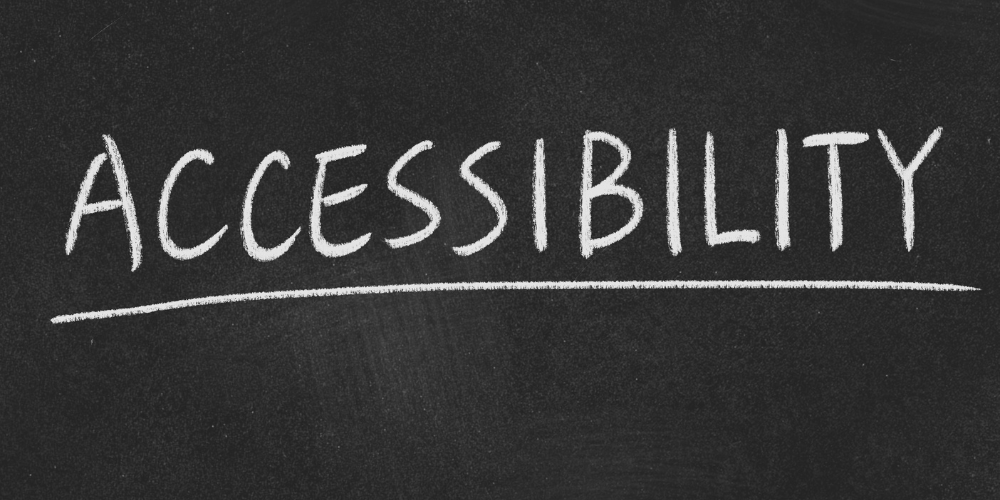 The word Accessibility written in white chalk on a dark gray chalkboard.
