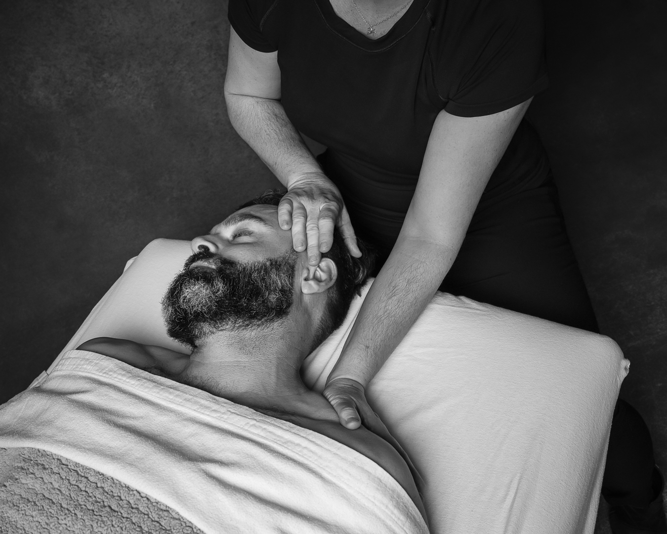 female receiving therapeutic neck massage