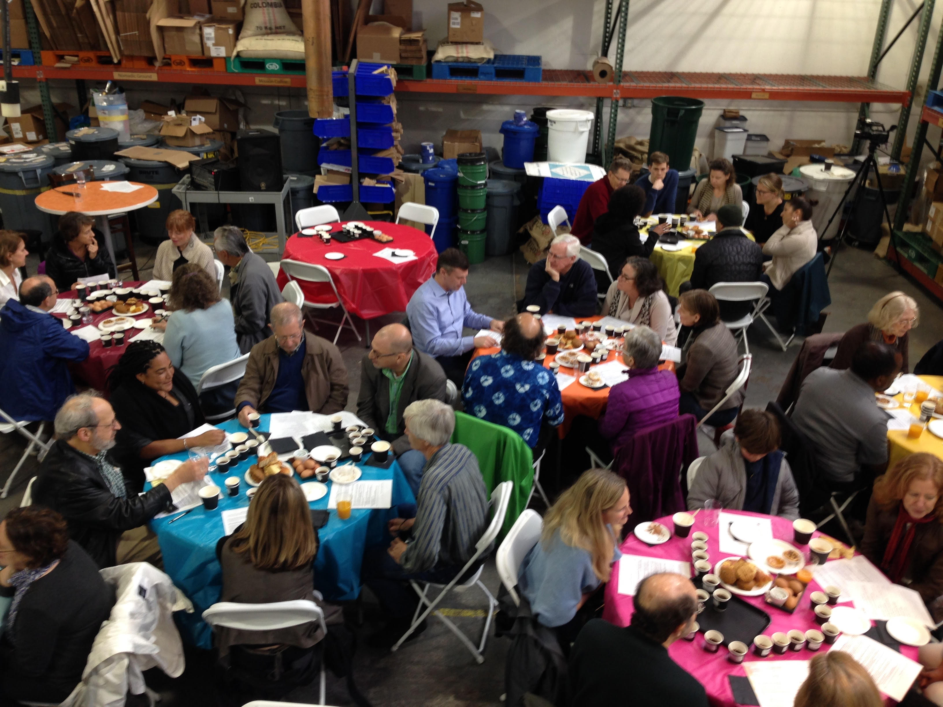 people talking around tables