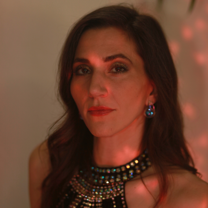 picture of dark haired girl lead singer of kitten around