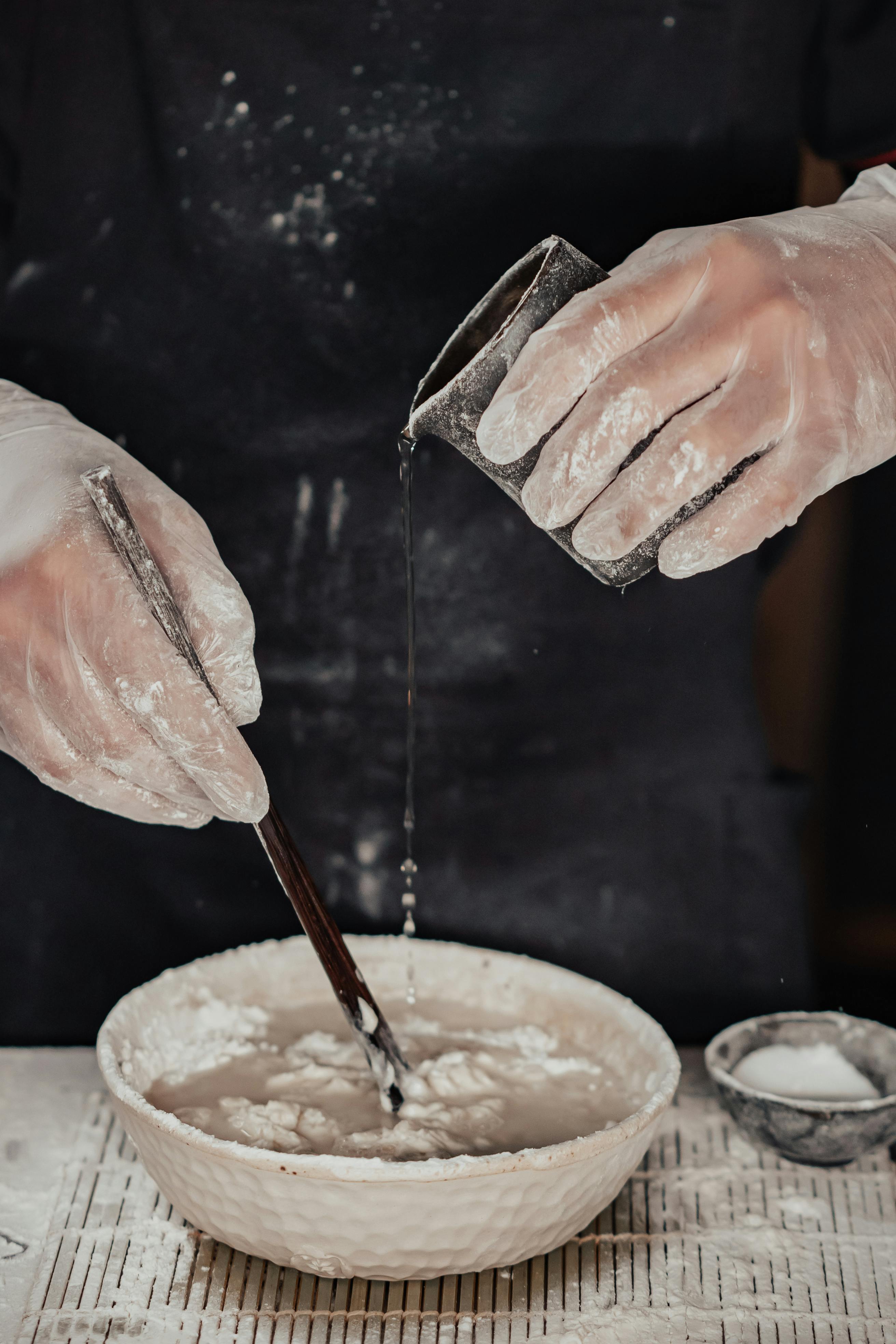 hands mixing together ingredients