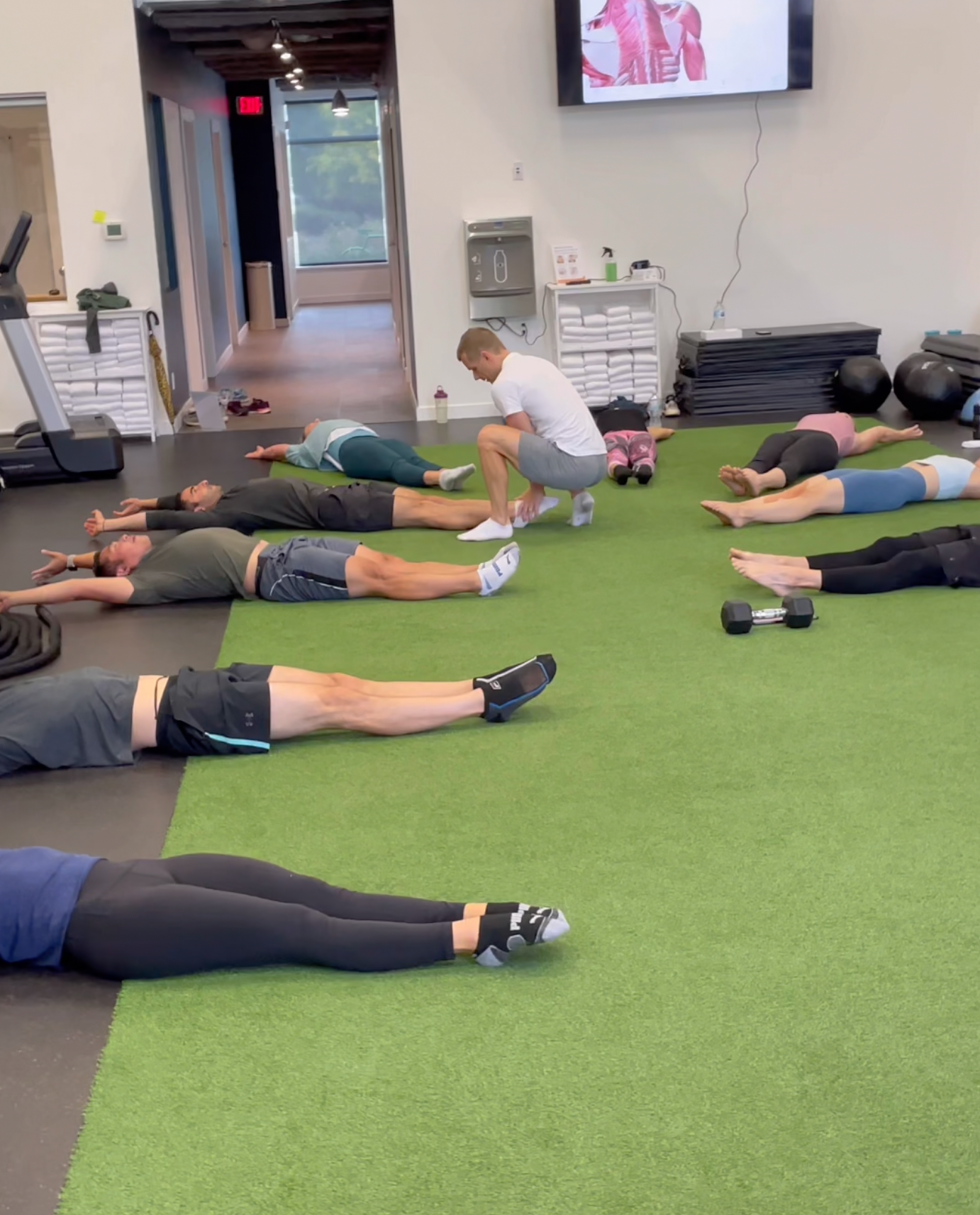 Trainer Maxim leading a gymnastics class