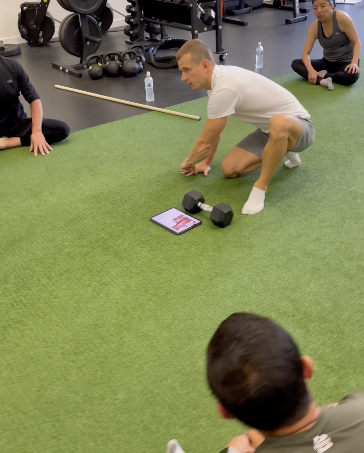 Trainer Maxim teaches gymnastics class