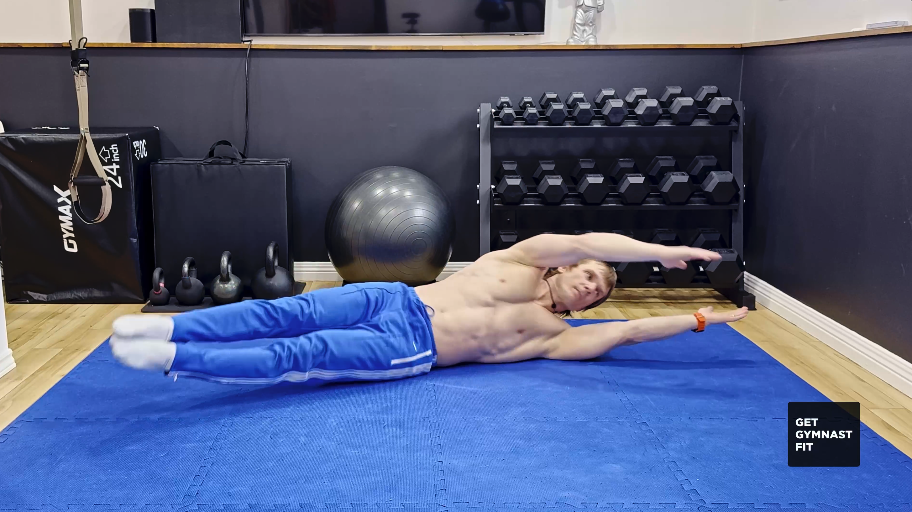Trainer Maxim demonstrates a gymnastics drill