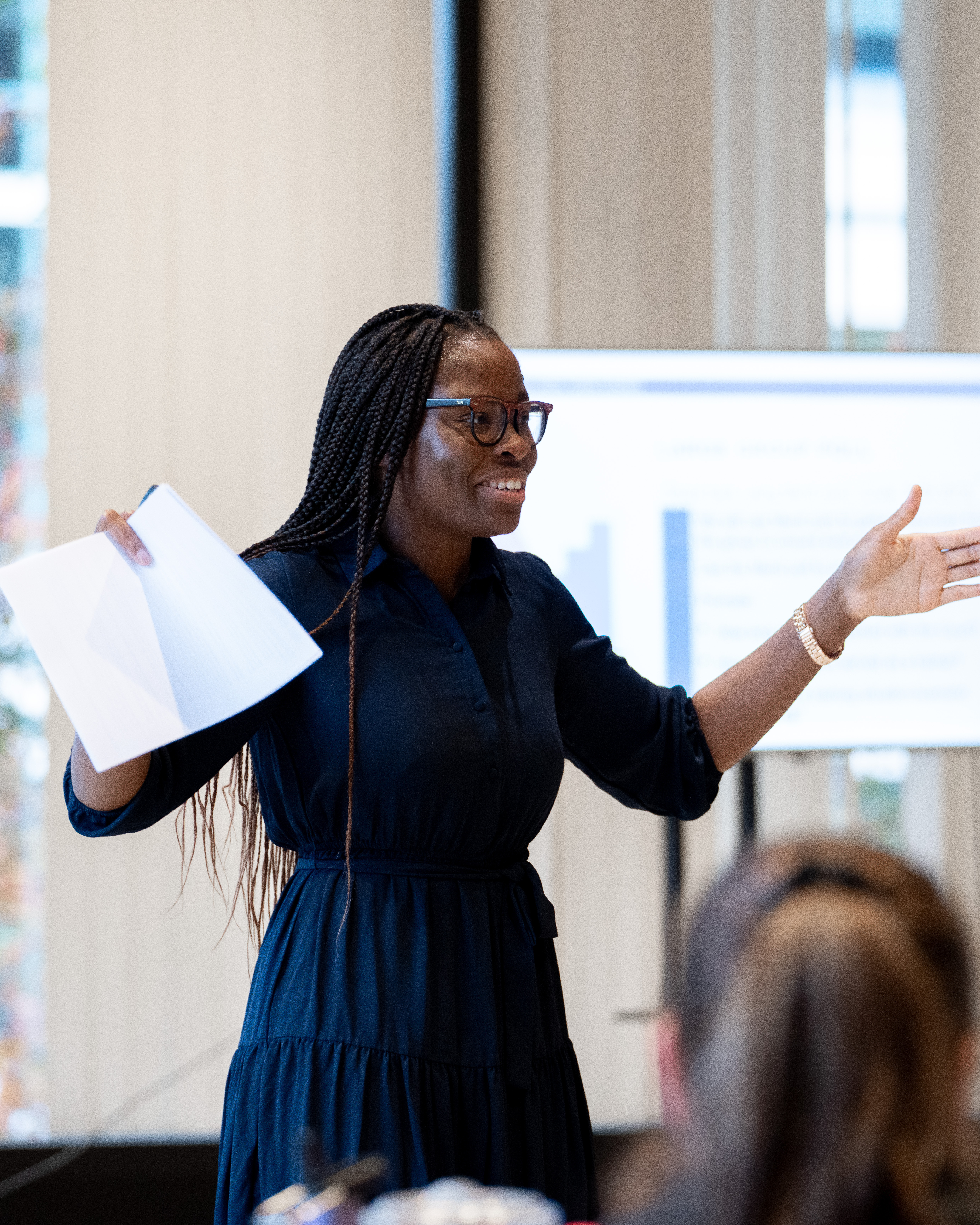 Image of Precious Ile as a keynote speaker for a professional development event.