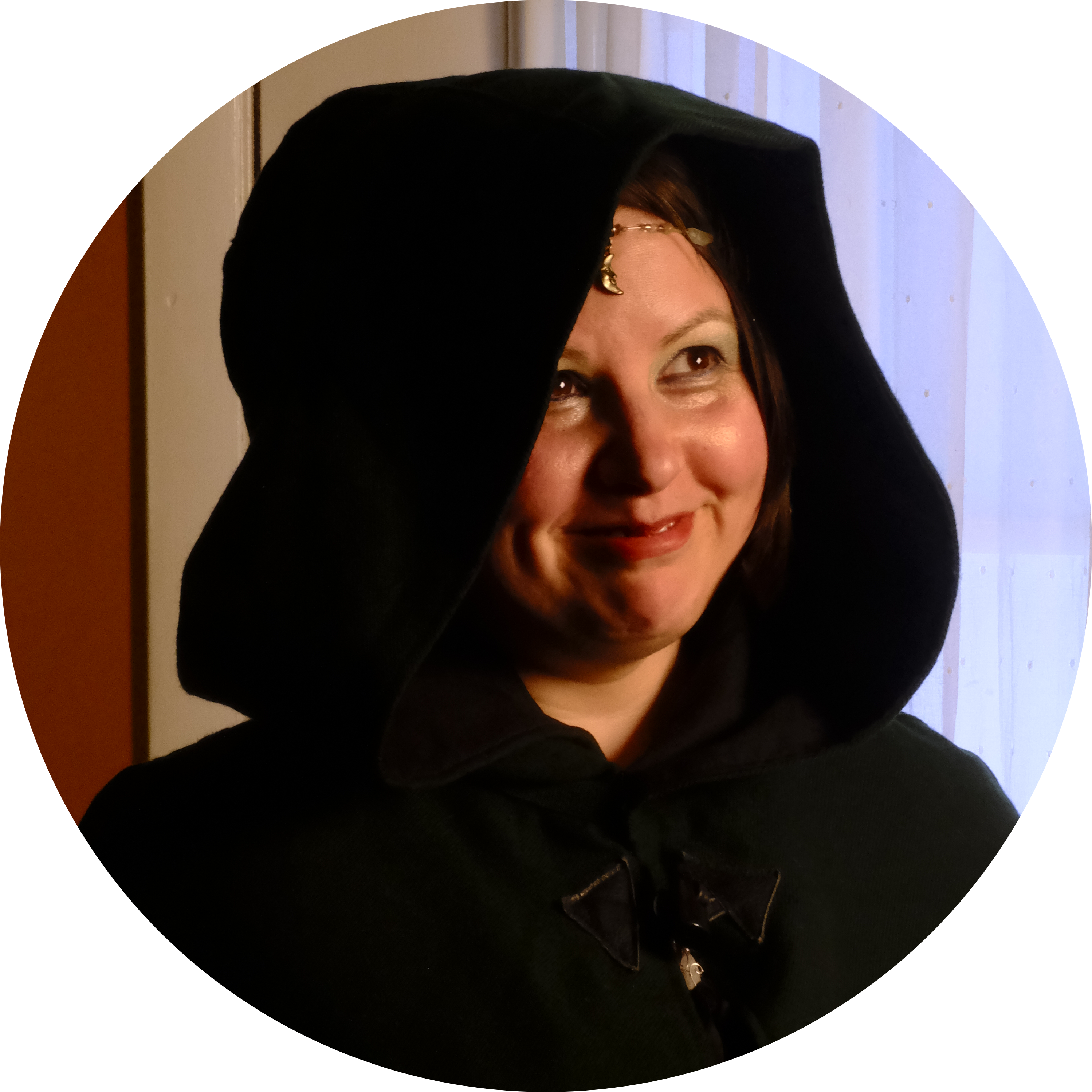 photograph of Evylyn Rose wearing a hooded cape