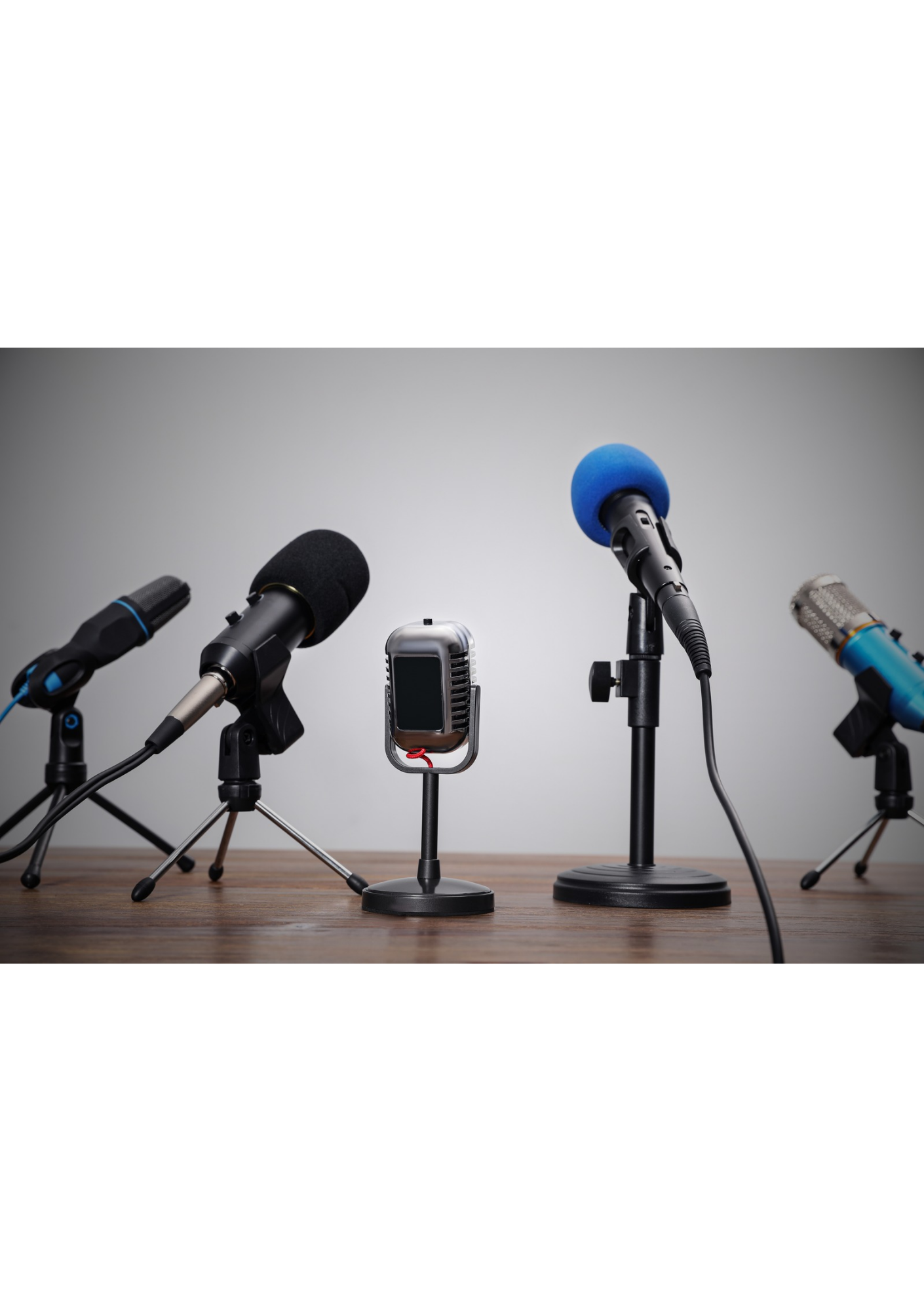 A bank of microphones on a desk