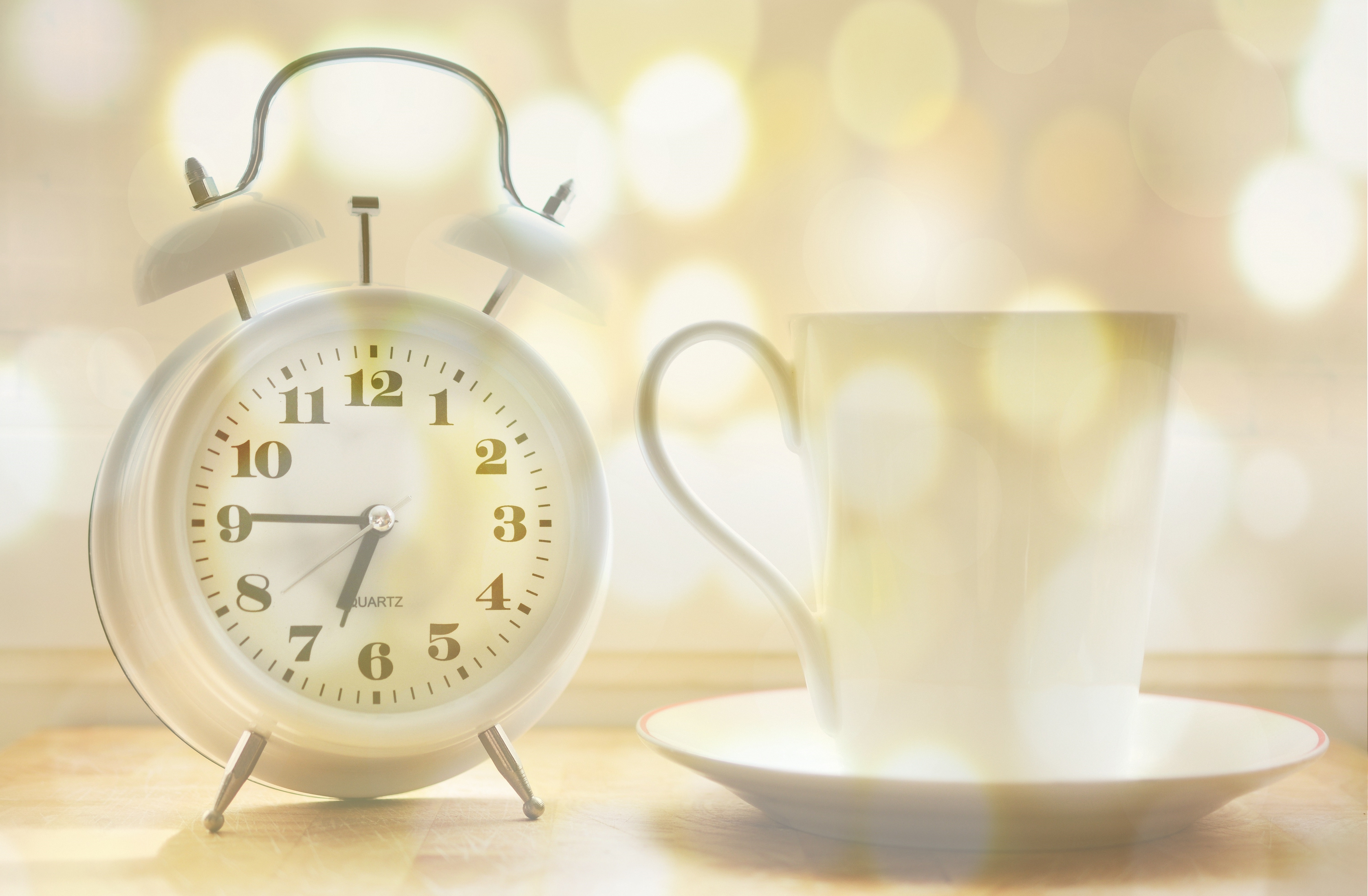 image of a clock and coffee cup