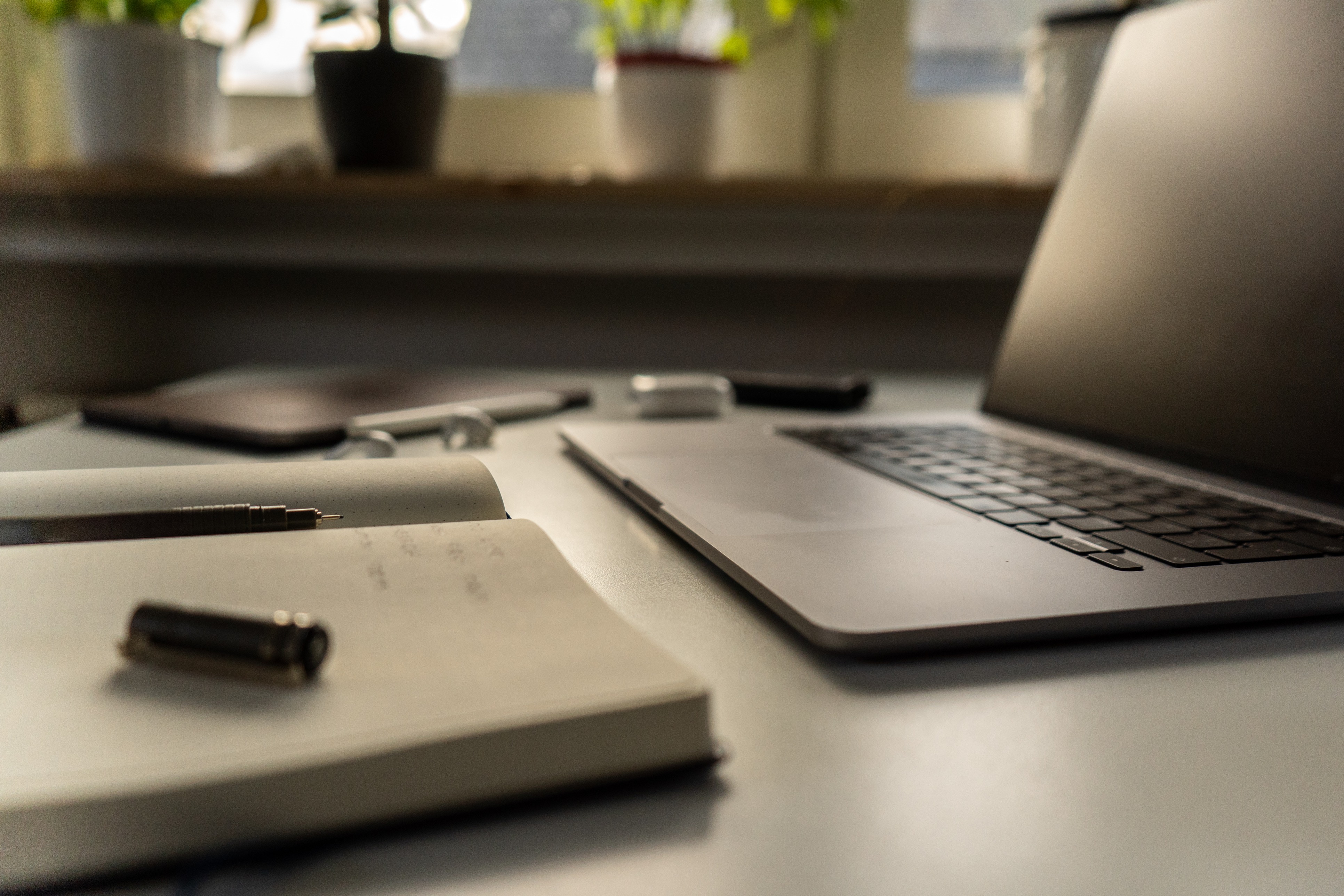 Hospitality exam preparation with laptop notes and study materials