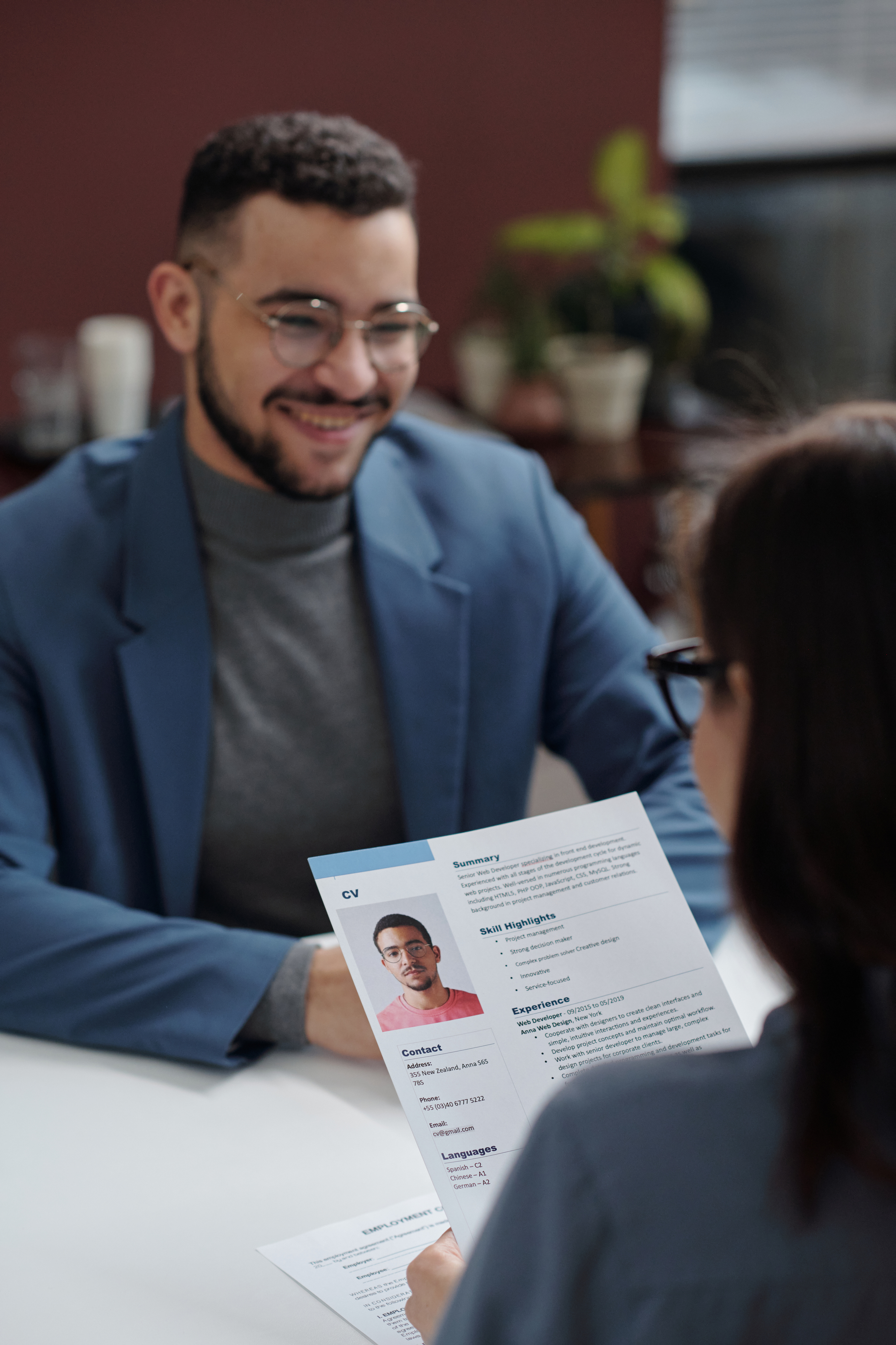 Recruiter reviewing a professional CV during a job interview, highlighting structured resume presentation for career success