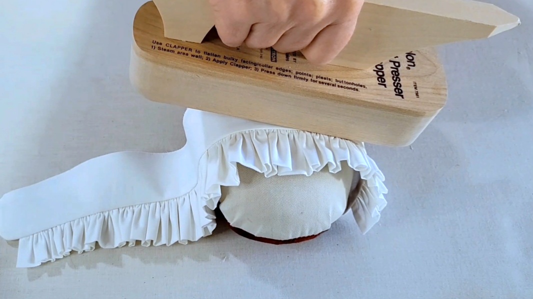 Couture Academy pressing a ruffle shirt collar