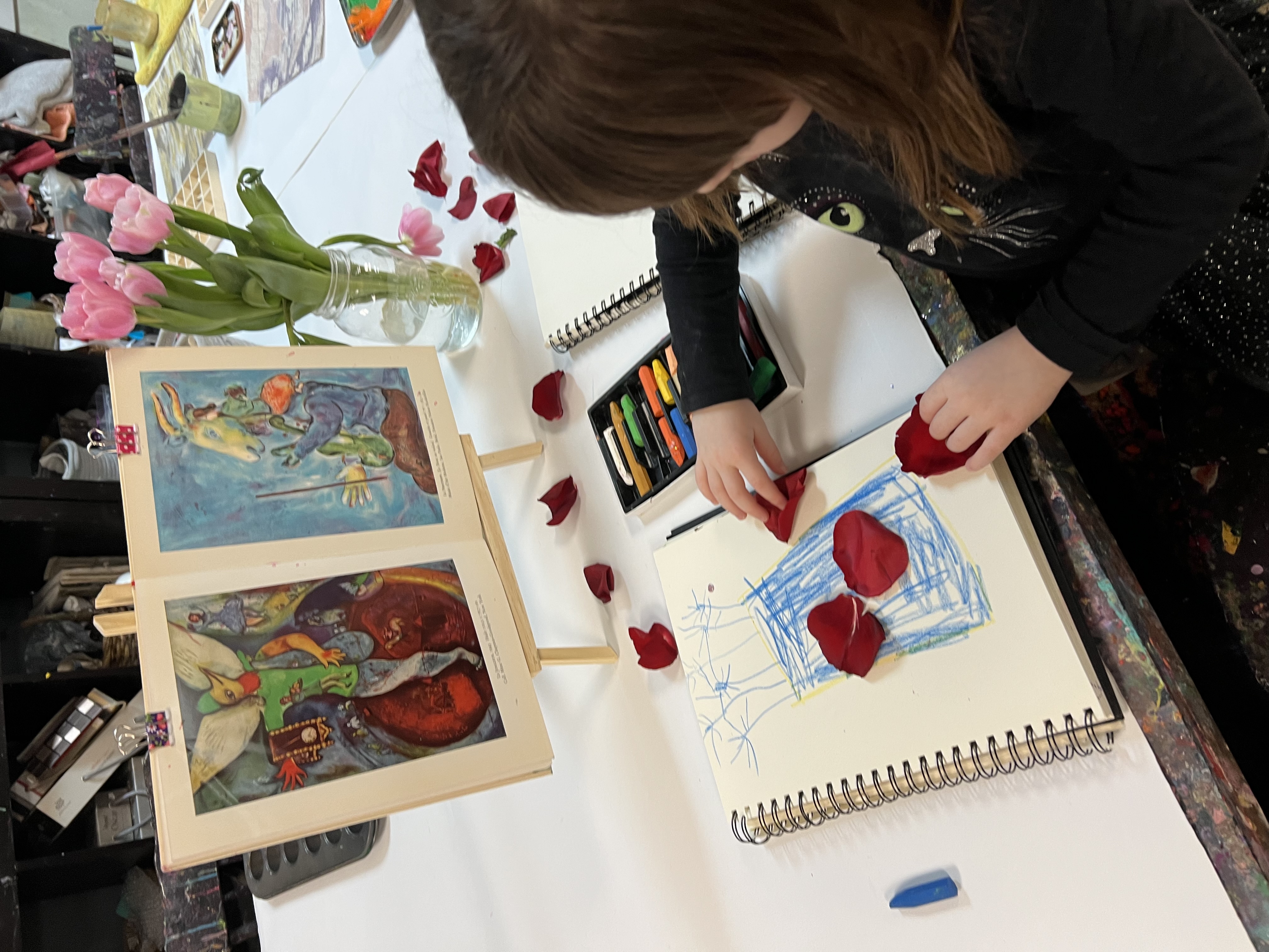 Child painting at an easel