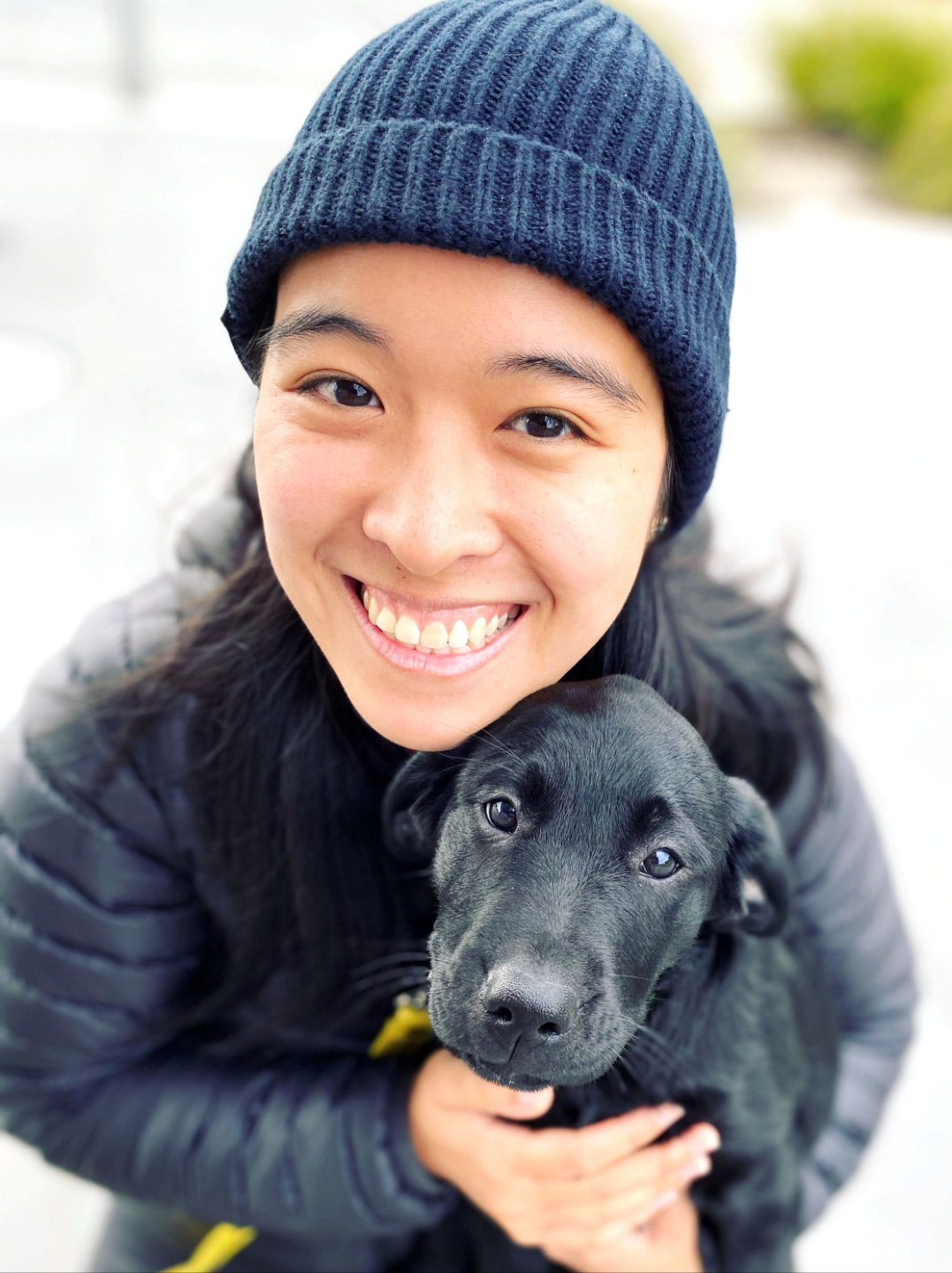 Melbourne dog trainer Diona Chu with her black Labrador Murphy