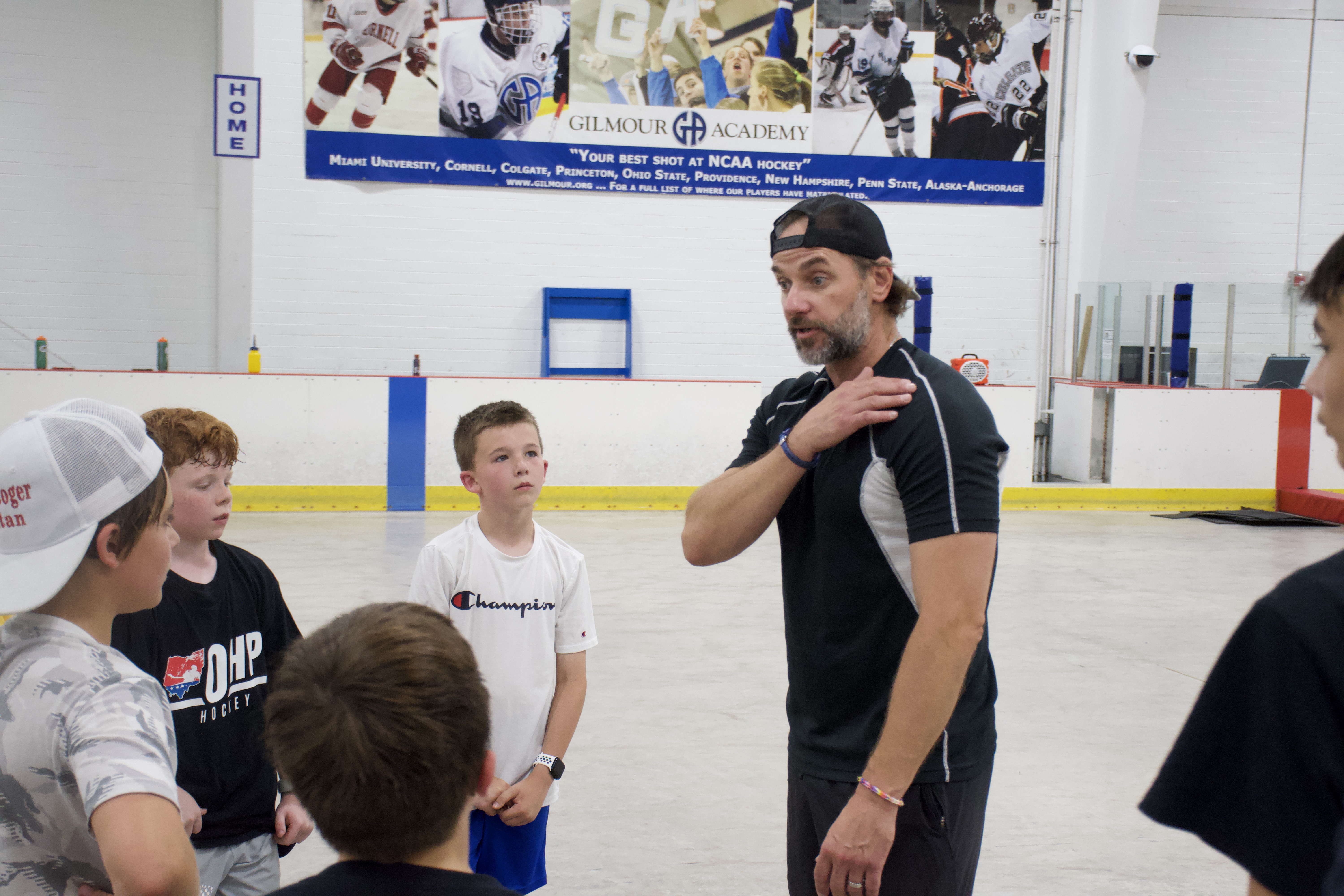 An OHP coach briefing a group of players