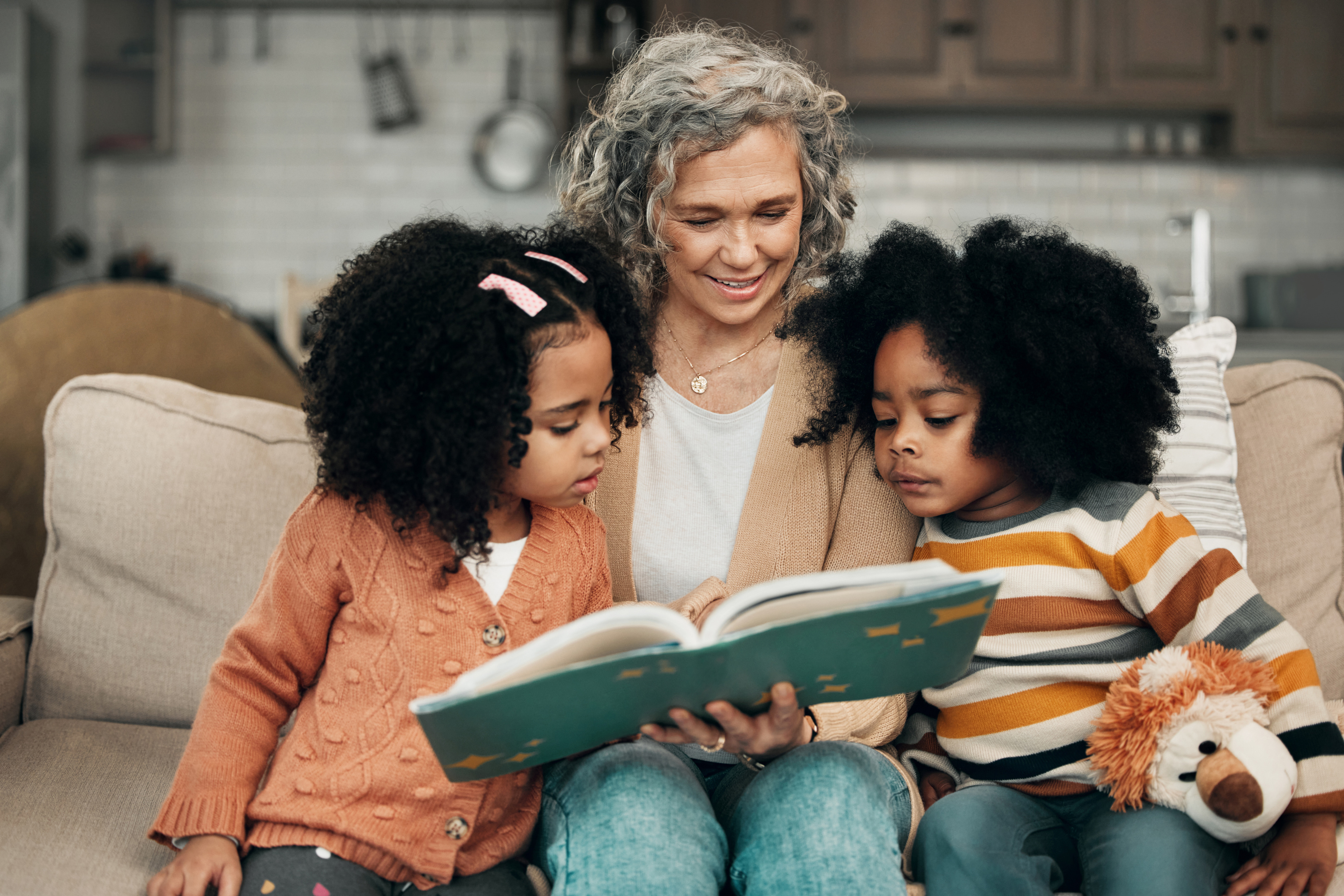 Woman reading books to children
