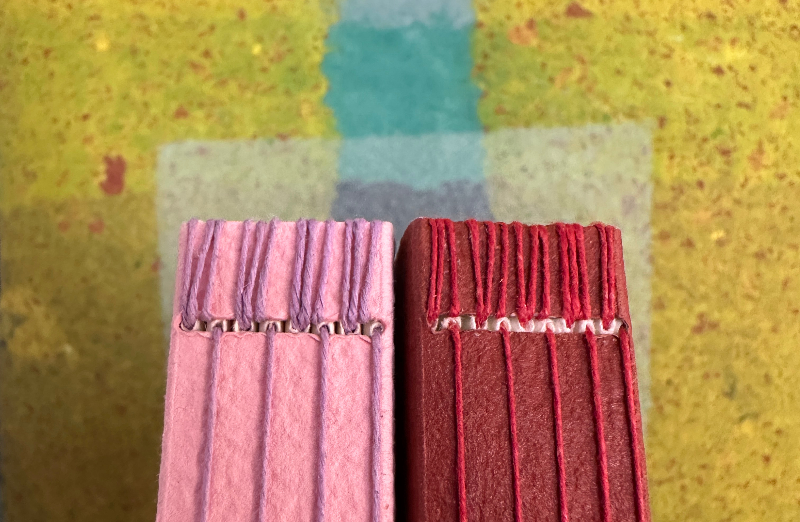 Detail of packing sewing at head edge of long stitch binding.