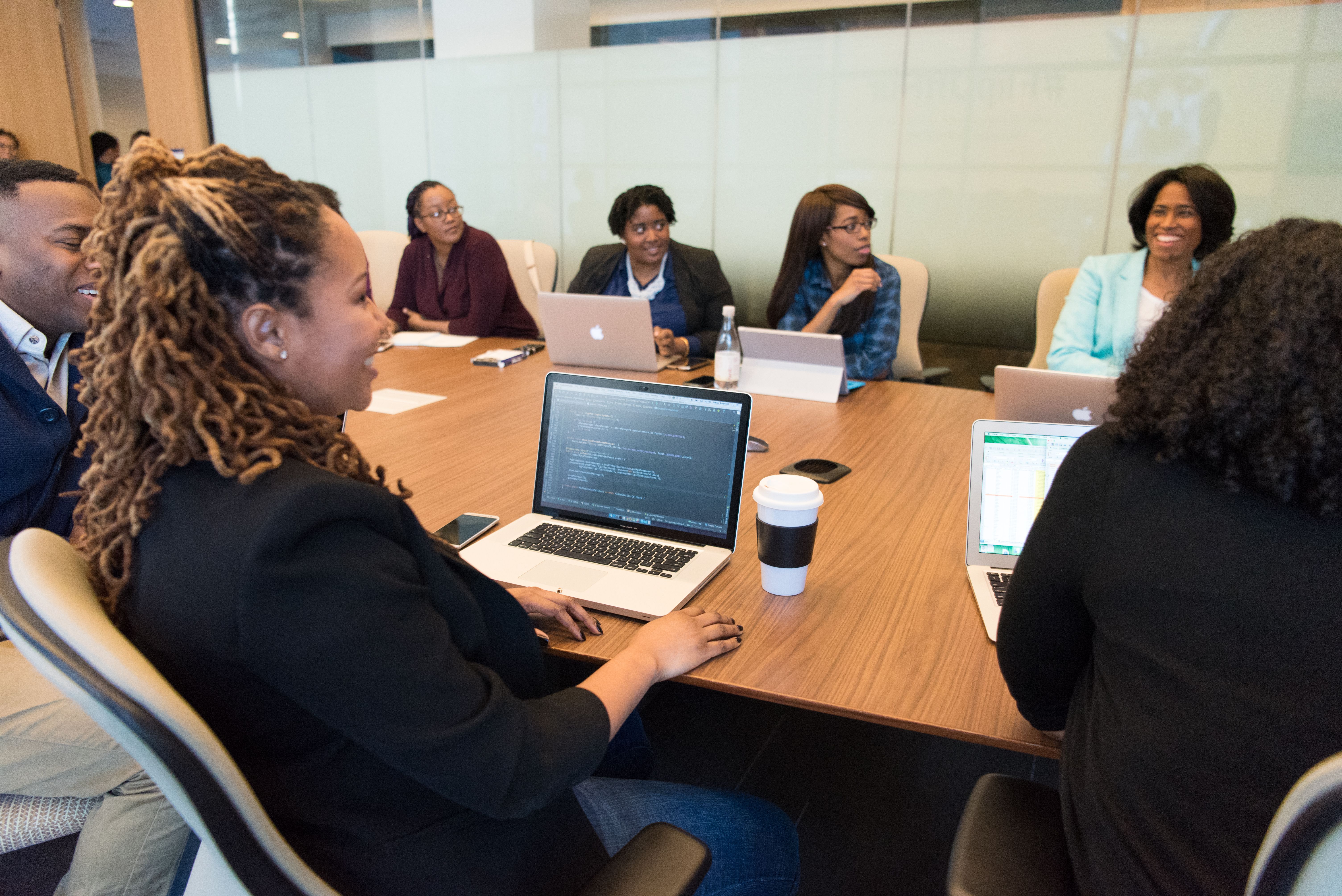 diverse professionals sitting in on a meeting